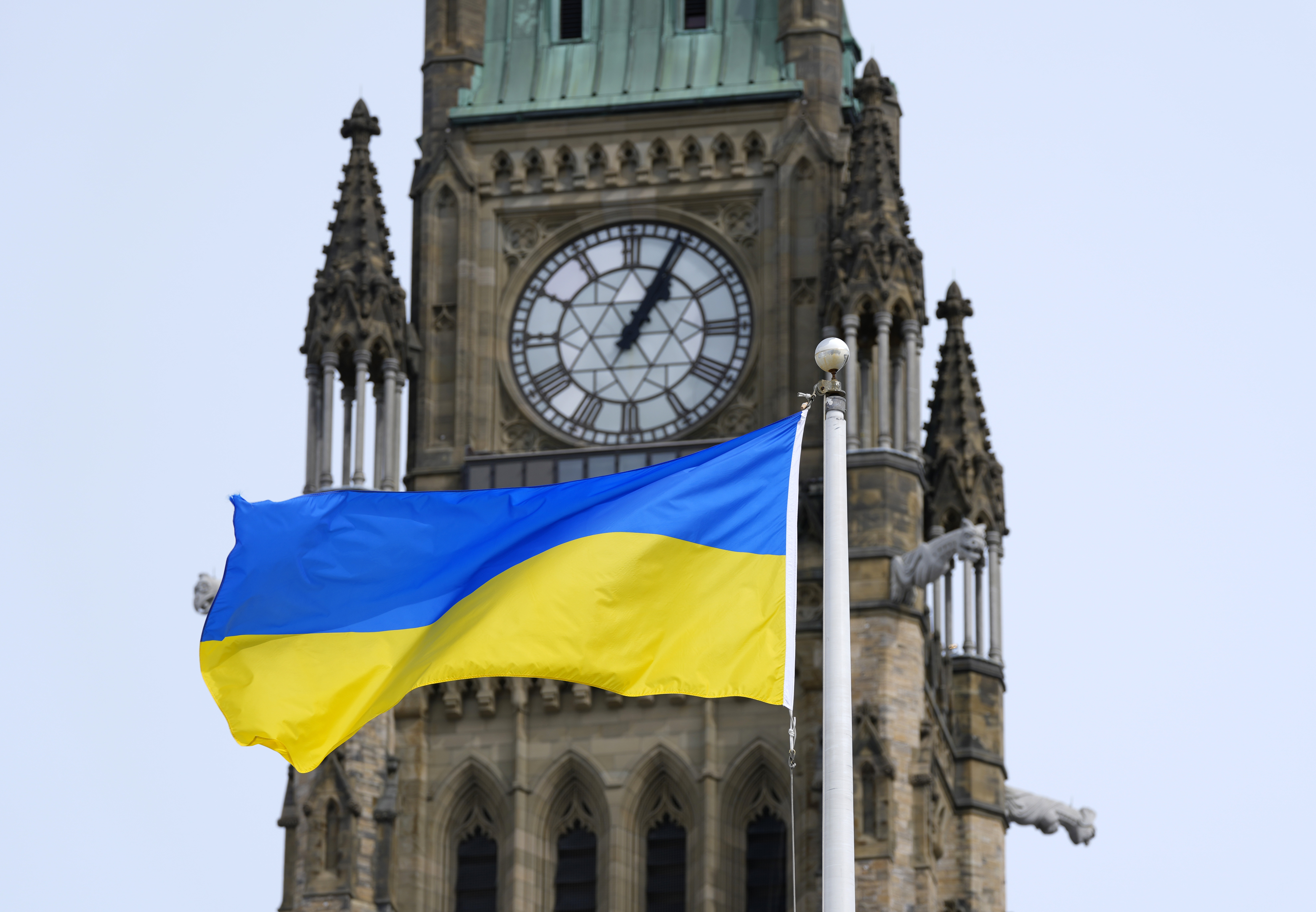 A Ukrainian flag flies in front of the Peace Tower on Parliament Hill.