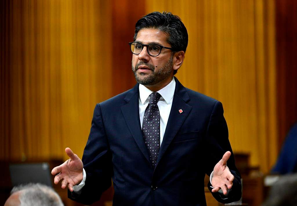 Ottawa MP Yasir Naqvi has stepped down from his role as a parliamentary secretary in order to possibly run for leadership of the provincial Liberals. Naqvi rises during Question Period in the House of Commons on Parliament Hill in Ottawa on Friday, Dec. 9, 2022. 