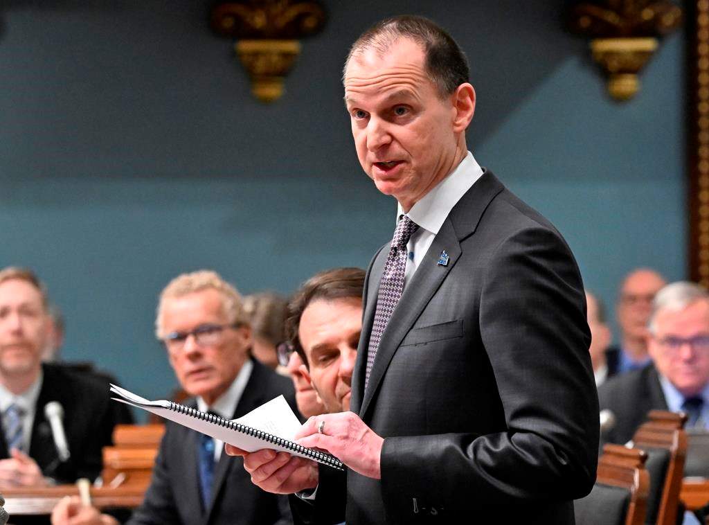 Quebec Finance Minister Eric Girard reads his budget speech, Tuesday, March 21, 2023 at the legislature in Quebec City.