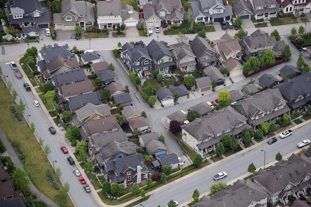 Houses and townhouses are seen in an aerial view in Langley, B.C., on Wednesday May 16, 2018.