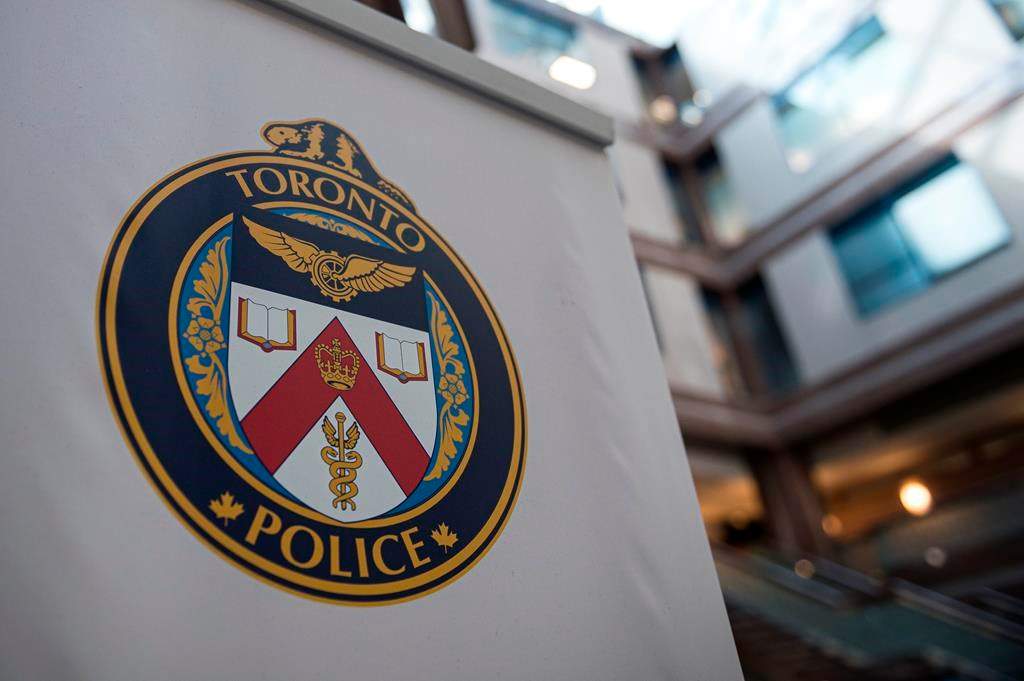 A Toronto Police Services logo is shown at headquarters, in Toronto, on Friday, August 9, 2019.Toronto police say they are investigating a possible hate crime after graffiti appeared on the walls of a mosque in the city. THE CANADIAN PRESS/Christopher Katsarov.