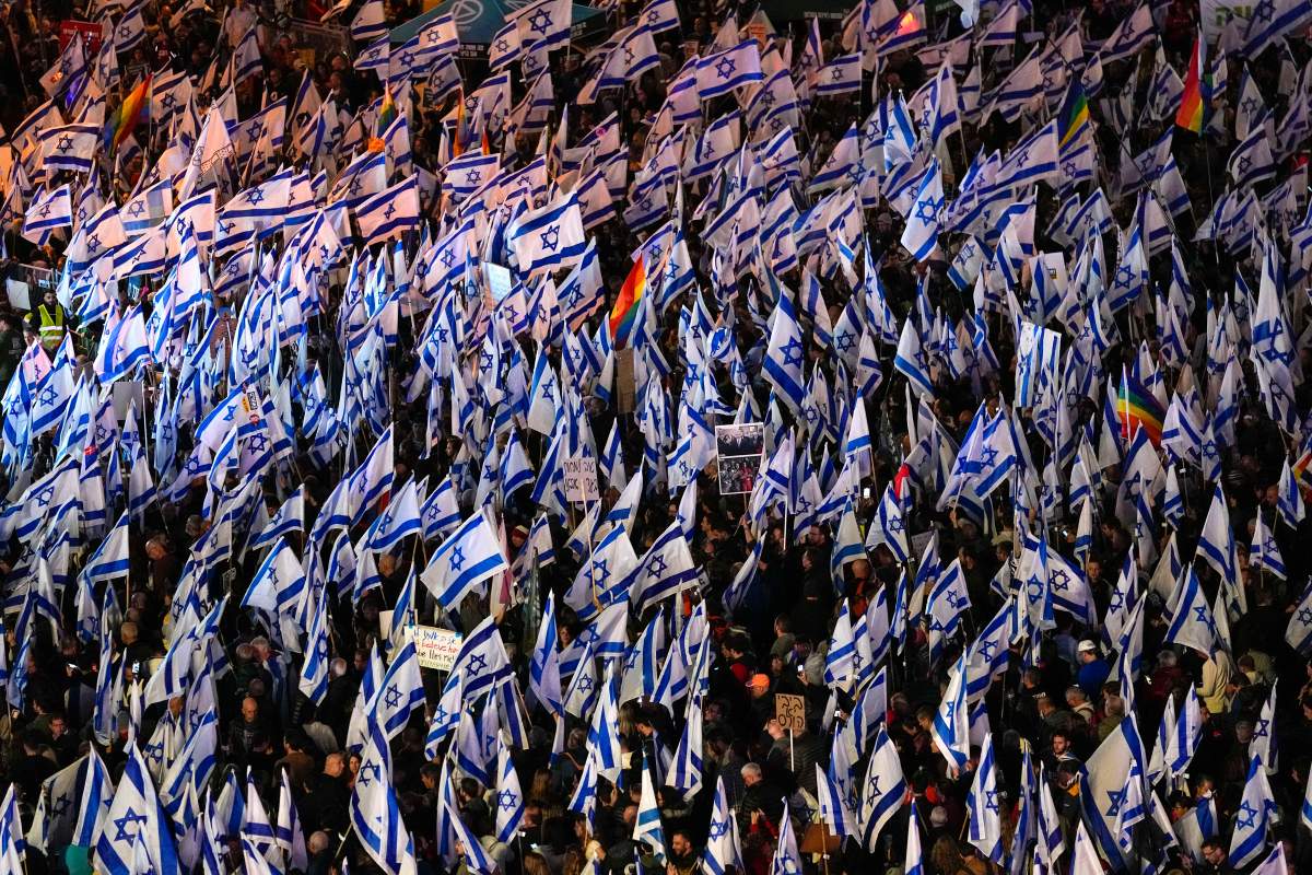 Israelis protest Saturday against plans by Prime Minister Benjamin Netanyahu’s government to overhaul Israel’s judicial system, in Tel Aviv, Israel. (AP Photo/Tsafrir Abayov)