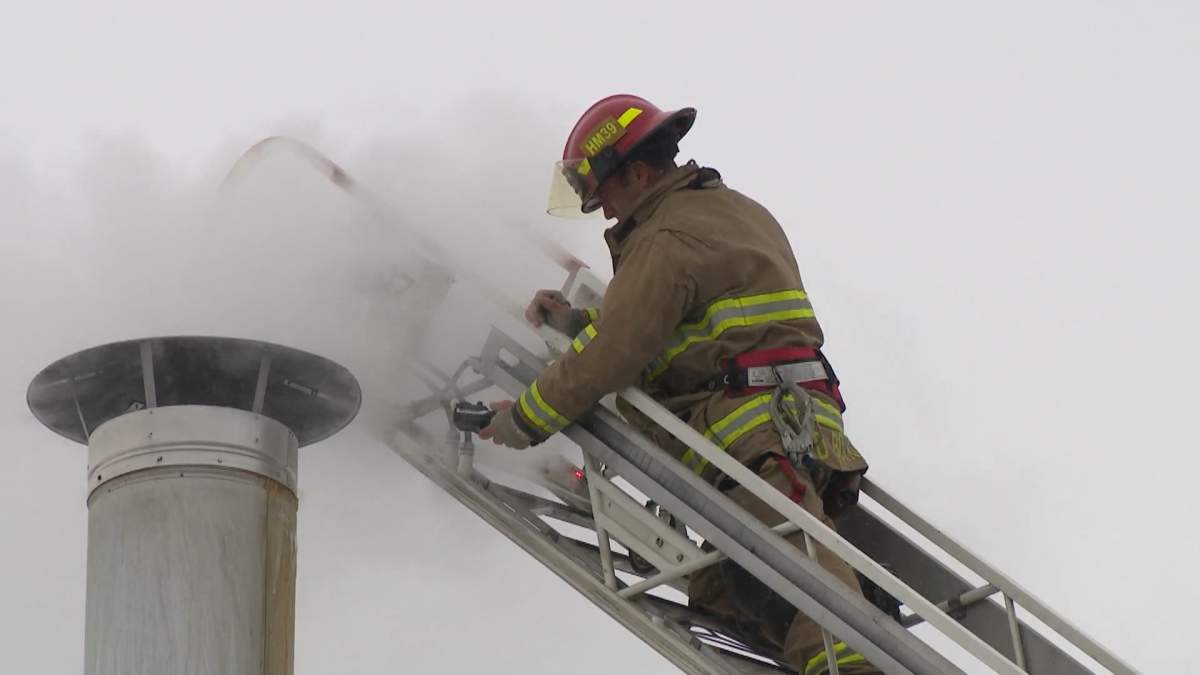 A CFD firefighter checks carbon monoxide levels at an apartment building on Friday, March 10, 2023.