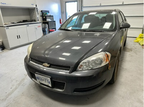 Jo-Anne Donovan’s grey Chevrolet Impala is seen in a garage. Donovan had not been seen or heard from since March 13, 2023.