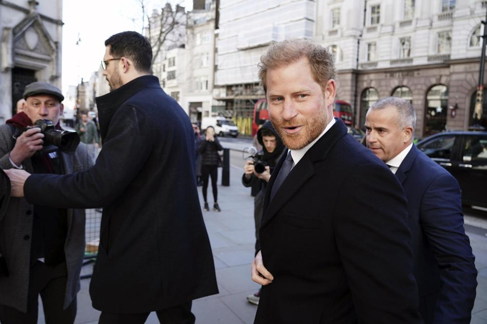 Prince Harry outside a courthouse.
