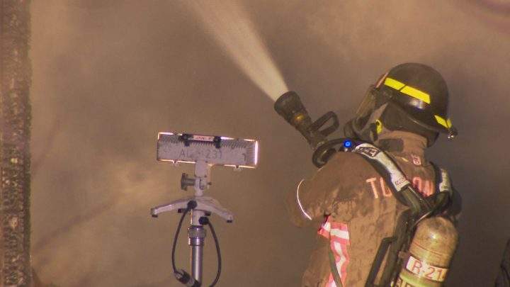 A firefighters during a fire on Neilson Road, Toronto, on Wednesday, March 8, 2023.