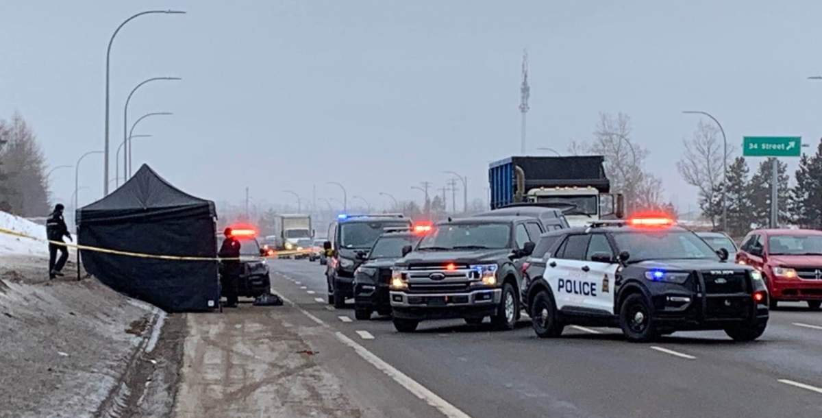 Police taped off an area beside Whitemud Drive eastbound between 34 and 17 streets on Tuesday, March 21, 2023.