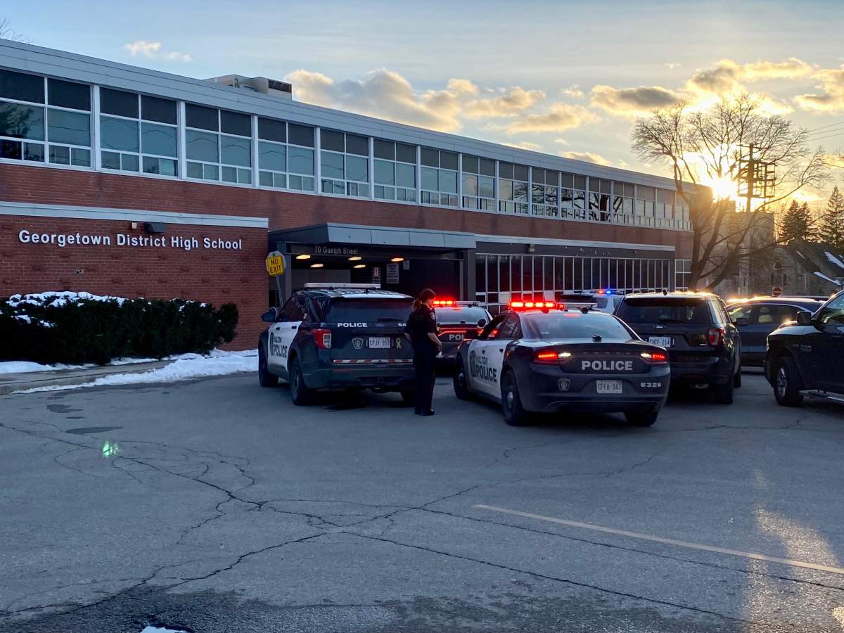 Police cruisers are seen outside of Georgetown District High School on Thursday.