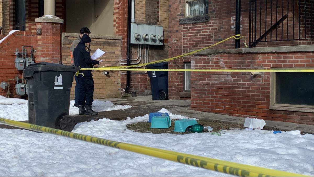 Investigators at the scene of a fatal fire on Dundonald Street in Toronto on March 14, 2023.