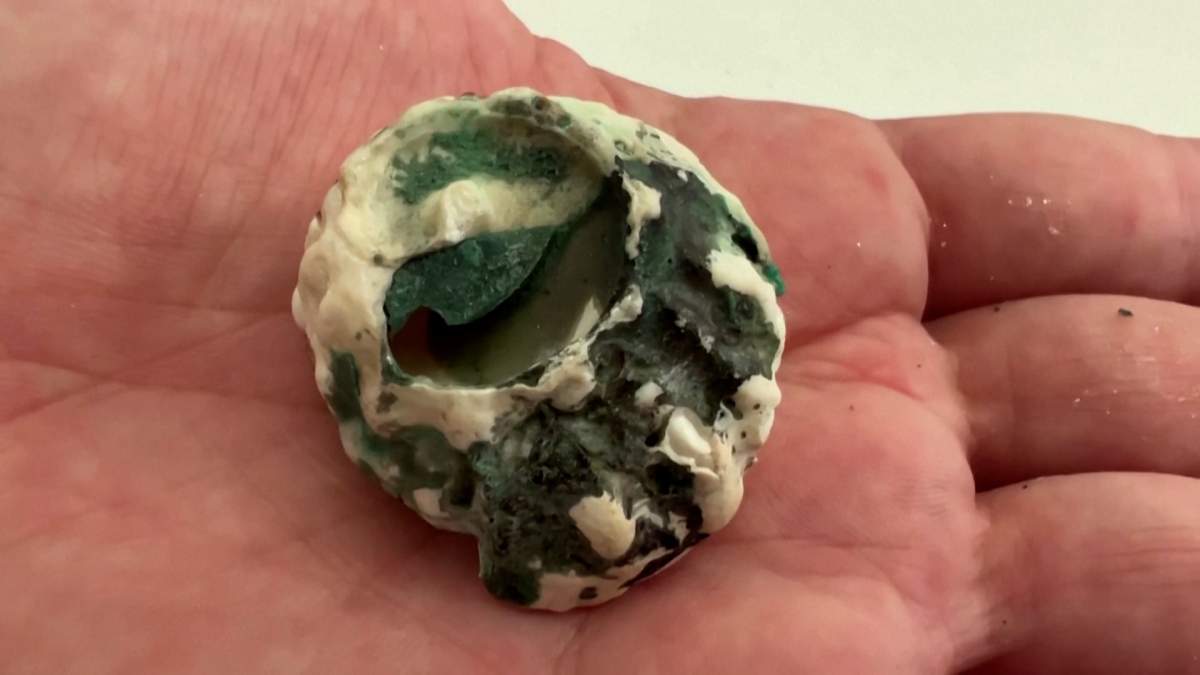 Melted plastic has become intertwined with rocks on the island.