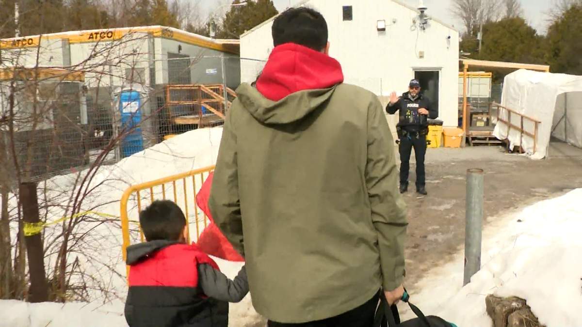 Migrants are told they will be arrested if they cross into Canada at the unofficial Roxham Road border crossing between Quebec and New York state