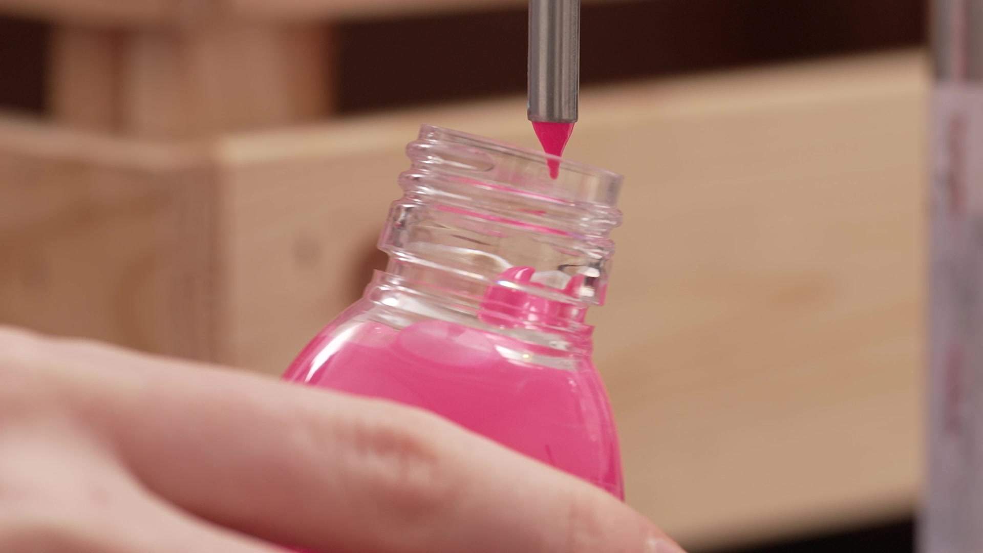 Filling a bottle of ‘The Pinkest Pink’ at Semple’s paint lab.