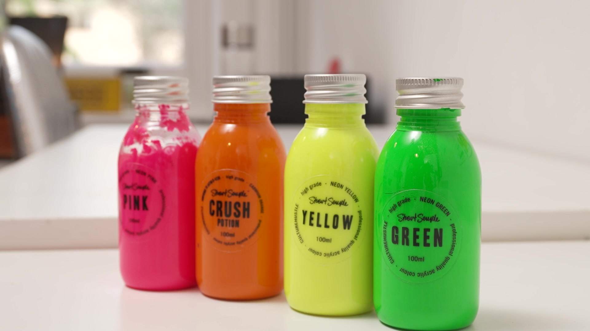 Bottles of Semple’s branded paints.