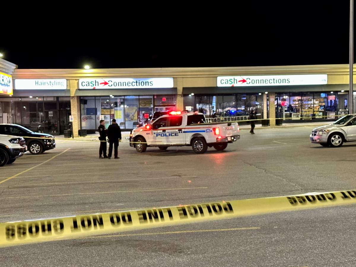Police at the scene following a shooting in Oshawa on Thursday, March 30, 2023.