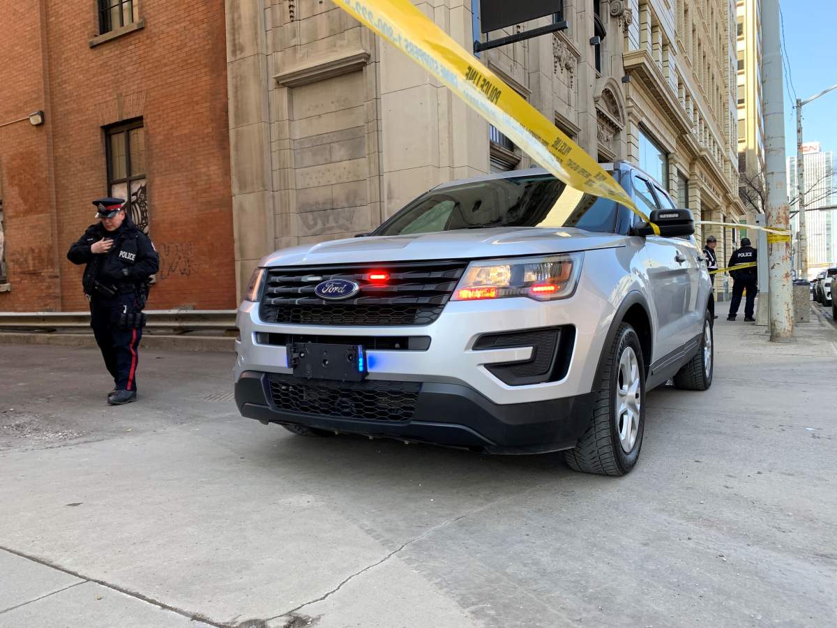 The Edmonton Police Service investigating the death of a man in an alley off 100 Street, north of Jasper Avenue, on Friday, March 31, 2023.