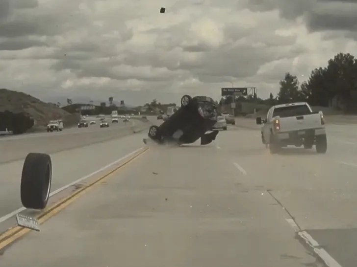 The car is seen bouncing on its roof and front end.