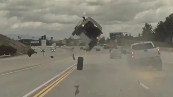 The car can be seen lifting high into the air.