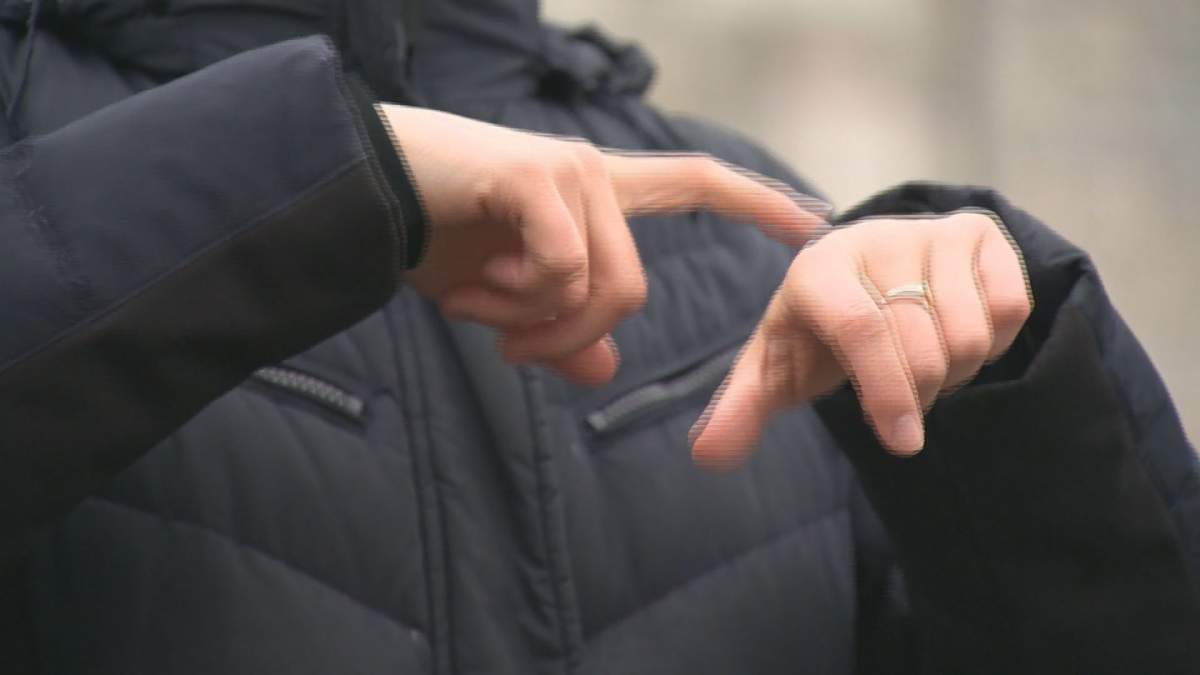 File photo of an interpreter using American Sign Language (ASL) to communicate.