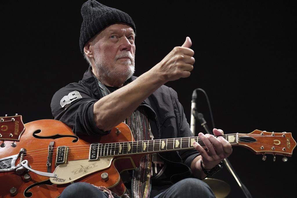 Canadian rock legend Randy Bachman poses with his reunited Gretsch guitar, which was stolen in 1977, during the Lost and Found Guitar Exchange Ceremony at the Canadian Embassy in Tokyo, Friday, July 1, 2022. Bachman will showcase more than 80 of his guitars in a new temporary exhibit set to open at Calgary's Studio Bell next month.