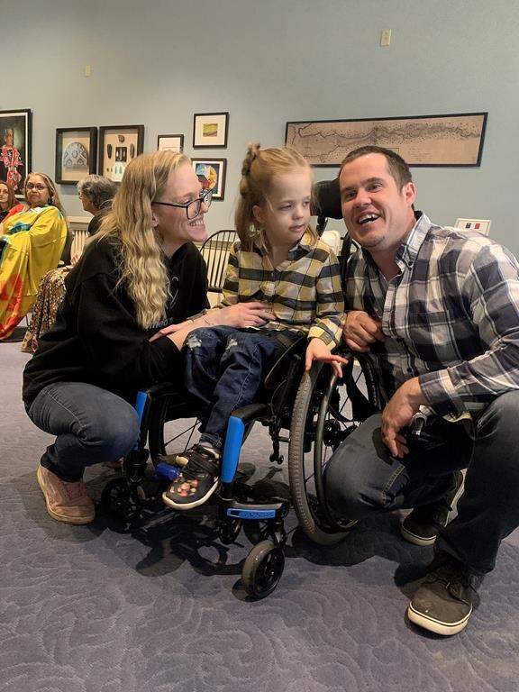 Kaylee and Nick Jones, and their daughter Sophie, are seen at the Nova Scotia legislature, in Halifax, Tuesday, April 11, 2023. The family were at the Nova Scotia legislature today to lobby for the province to begin covering the cost of using cannabis oil to treat a form of epilepsy that causes seizures in their child.