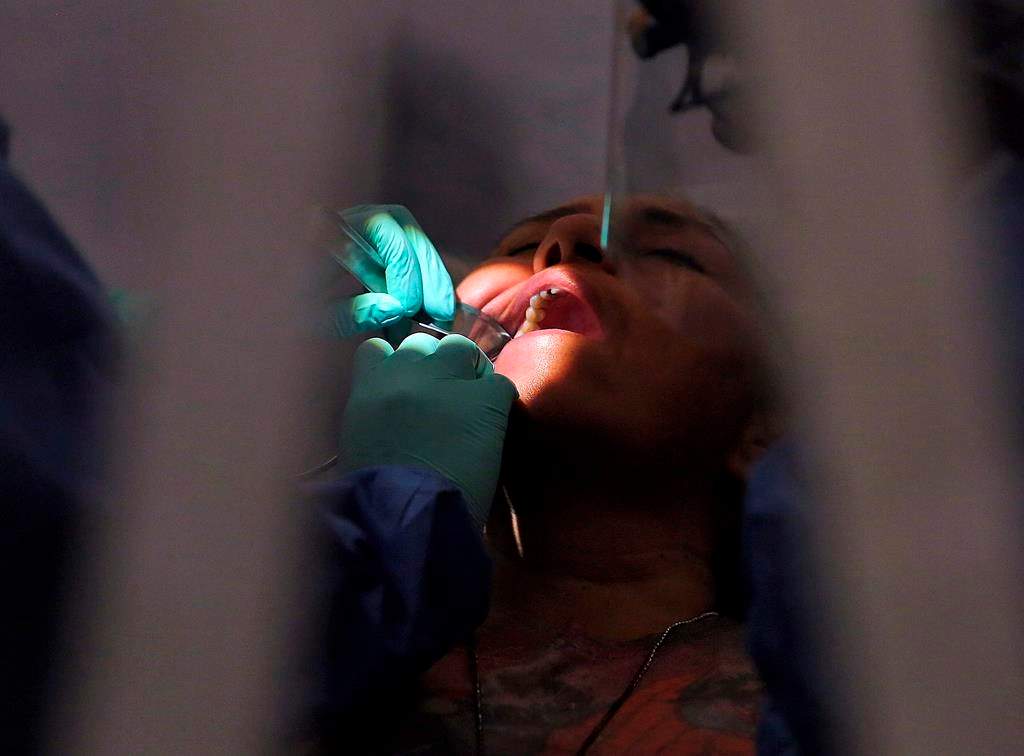 FILE photo. - The federal housing and dental benefits rolled out last year have had 'atrocious' take-up, a new report says, with hundreds of thousands of Canadians potentially missing out on the benefits. THE CANADIAN PRESS/AP-Joel Martinez/The Monitor via AP.