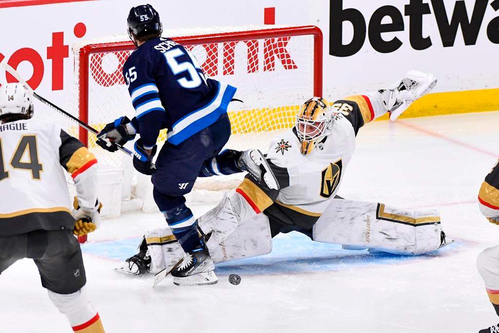 Vegas Golden Knights goaltender Laurent Brossoit (39) makes a save on Winnipeg Jets’ Mark Scheifele (55) during first-period Game 4 NHL Stanley Cup first-round hockey playoff action in Winnipeg on Monday April 24.