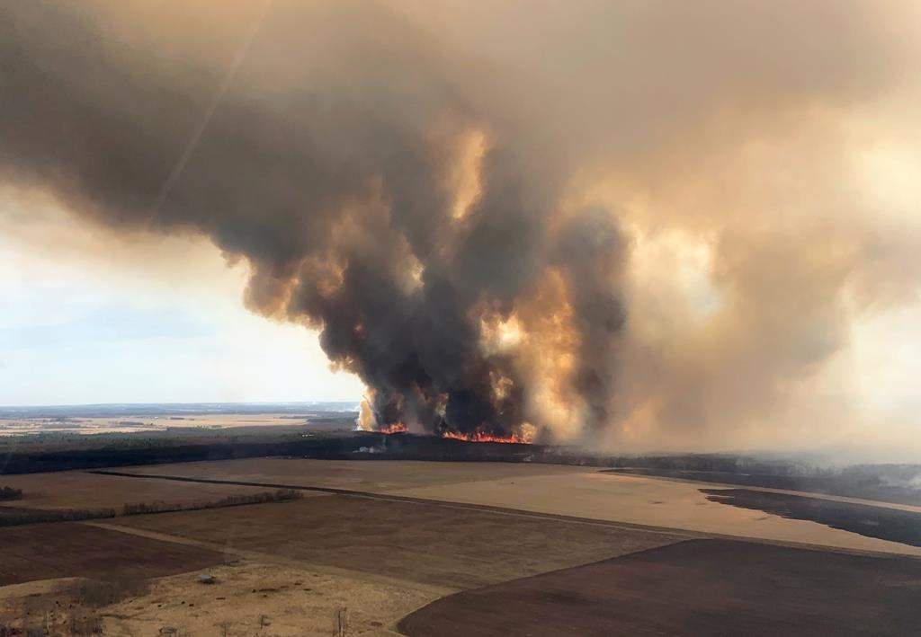 A large grass fire is shown on Sunday, April 30, 2023, in this handout image provided by Alberta Forestry, Parks and Tourism department. As some Albertans were being told to evacuate or to be ready to flee to safety at a moment’s notice due to multiple grass and brush fires in areas west and northwest of Edmonton. Others were being allowed to return home.