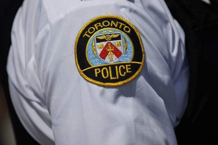 Toronto Police Superintendent Steve Watts of the Organized Crime Enforcement unit, listens during a press conference announcing new gun control laws, in Toronto, Friday, Aug. 5, 2022. 