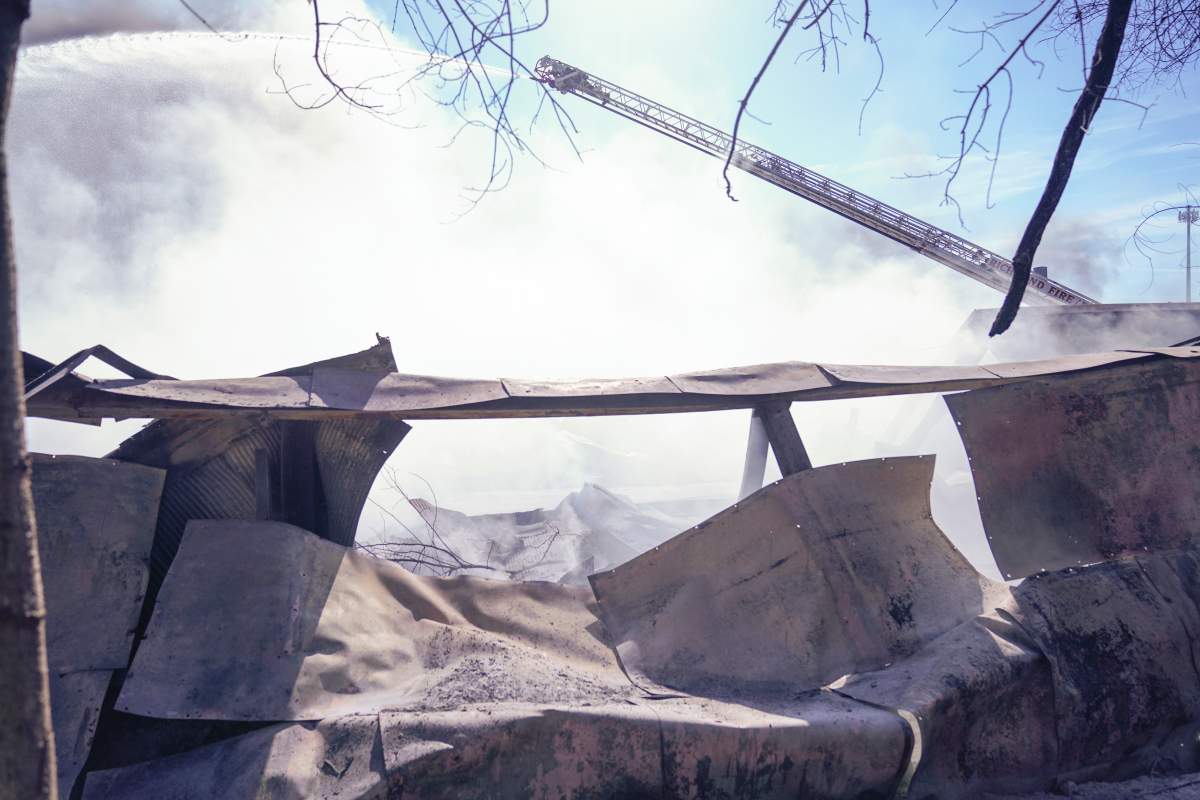Firefighters continue to pour water on an industrial fire in Richmond, Ind., Wednesday, April 12, 2023.