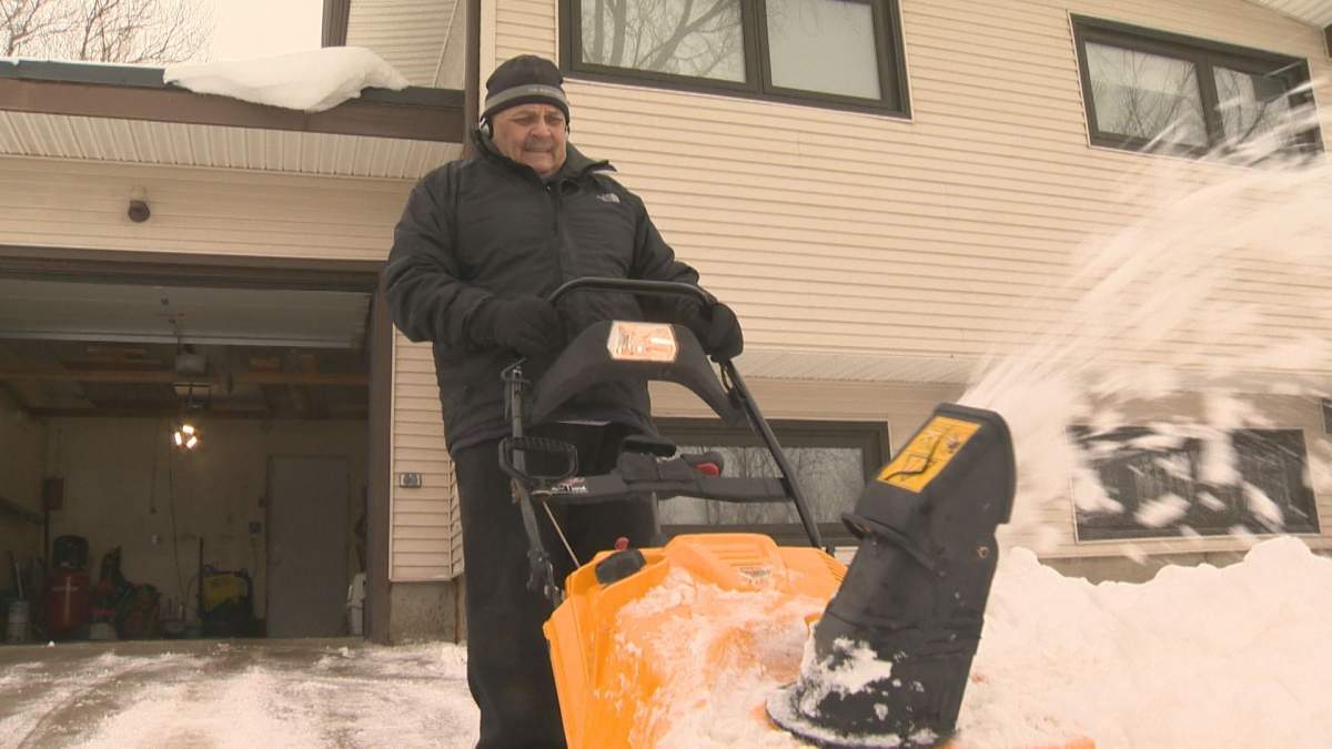 Allan Parenteau had to break out the snowblower Friday to keep up with all the snow that had fallen in Regina over the last week.