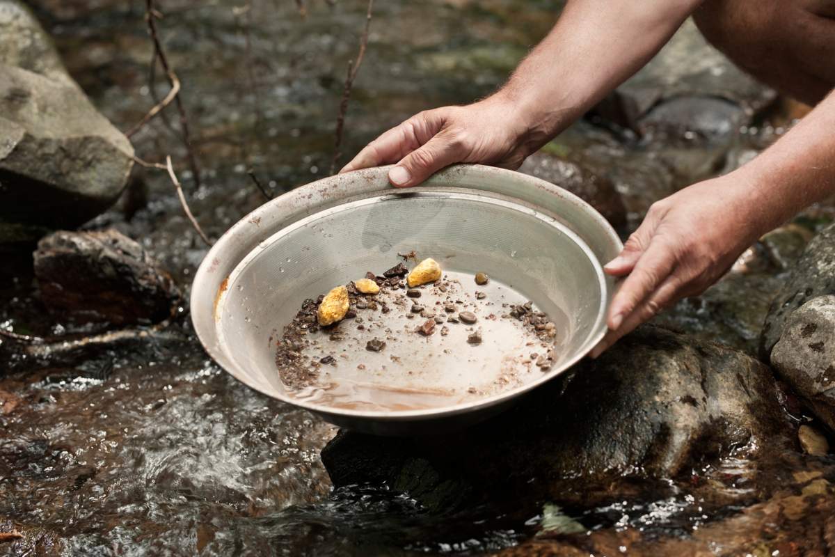 File - person panning for gold.