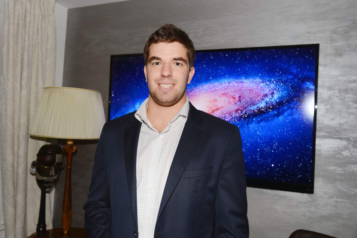 Billy McFarland in a black suit jacket.