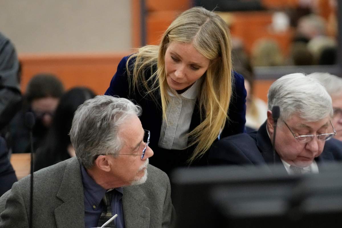Gwyneth Paltrow leans down to talk to Terry Sanderson.