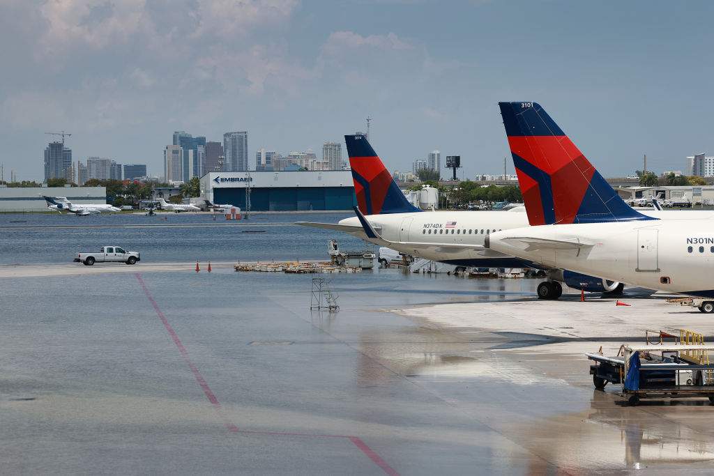 Planes sit at their gates after the Fort Lauderdale-Hollywood International Airport was closed due to the runways being flooded on April 13, 2023 in Fort Lauderdale, Florida.
