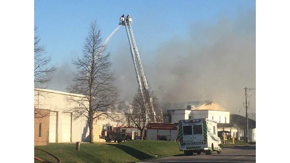 Firefighters battling a blaze at Moyer’s Apple Products on Christie Dr. in Beamsville, Ont.