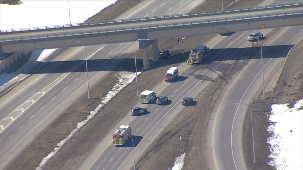 Emergency crews attend a fatal collision on Highway 22X in the southwest corner of Calgary, on April 6, 2023.