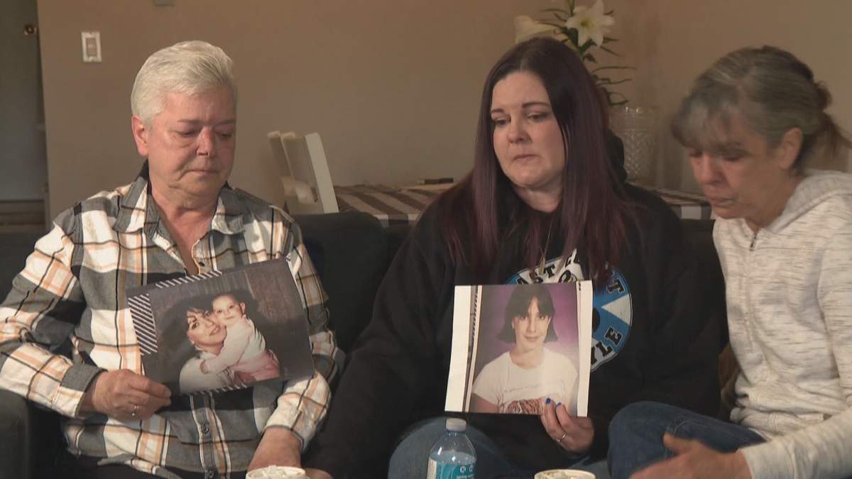 Family and friends of Tara Miller hold her picture on April 6, 2023.