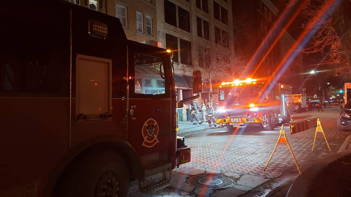 Firefighters at the scene early Friday outside the Royal Albert Arms hotel in Winnipeg.
