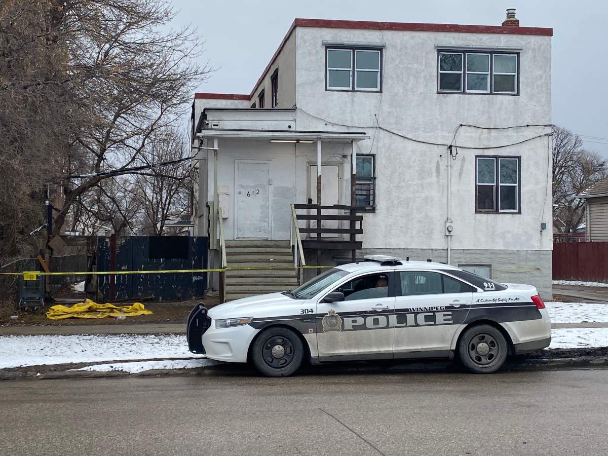Winnipeg police outside a Flora Avenue home on Thursday morning.