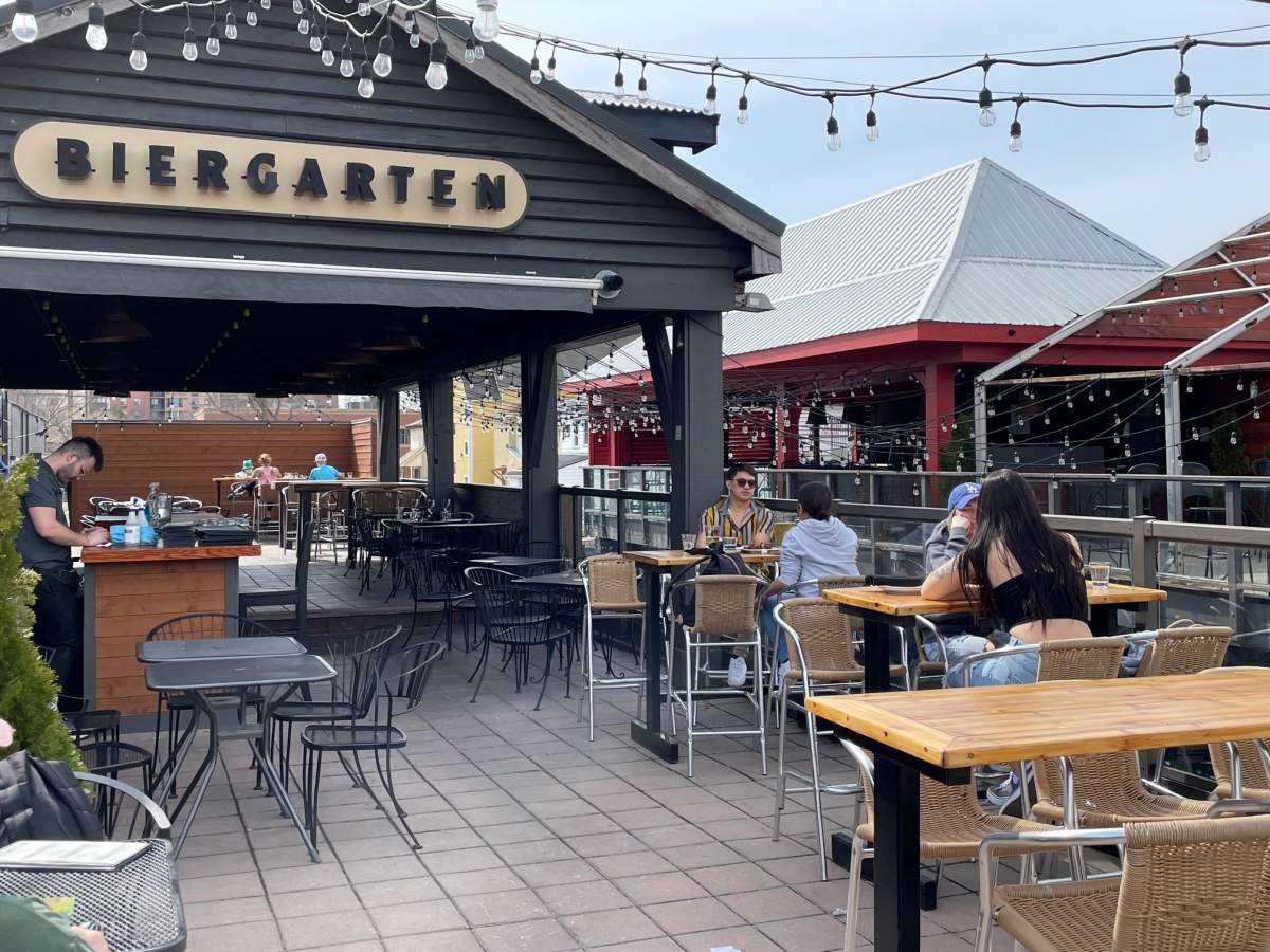 A few patrons sit on the patio at Toboggan in London, Ont., on April 11, 2023.