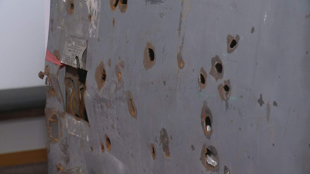 A door in the exhibit can be seen with bullet holes.