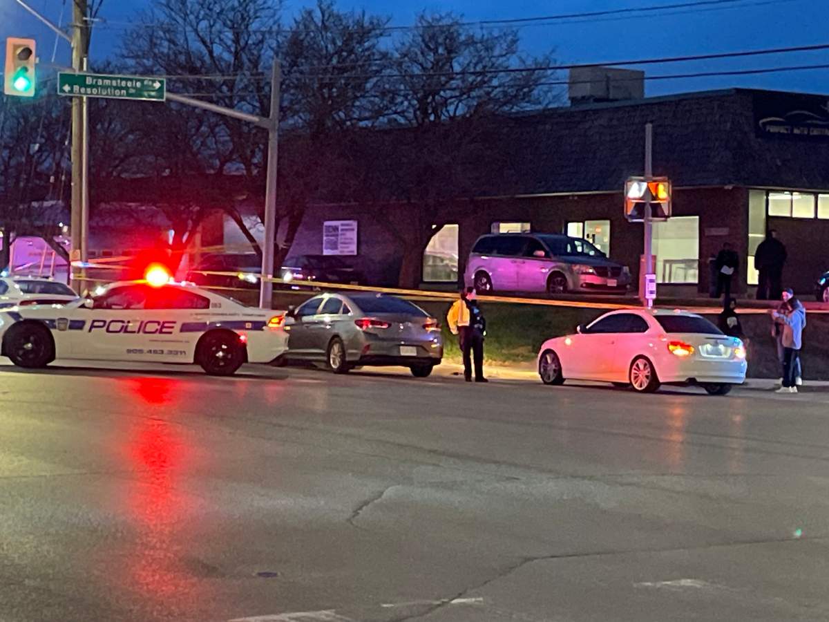 Police at the scene of a fatal shooting near Resolution Drive and Rutherford Road South in Brampton on April 20, 2023.