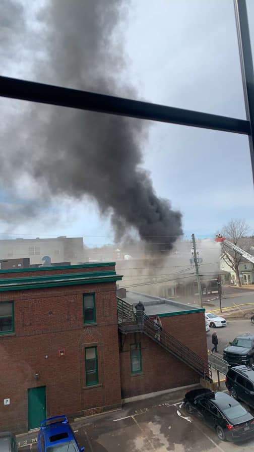 The fire sent thick clouds of smoke into the air.