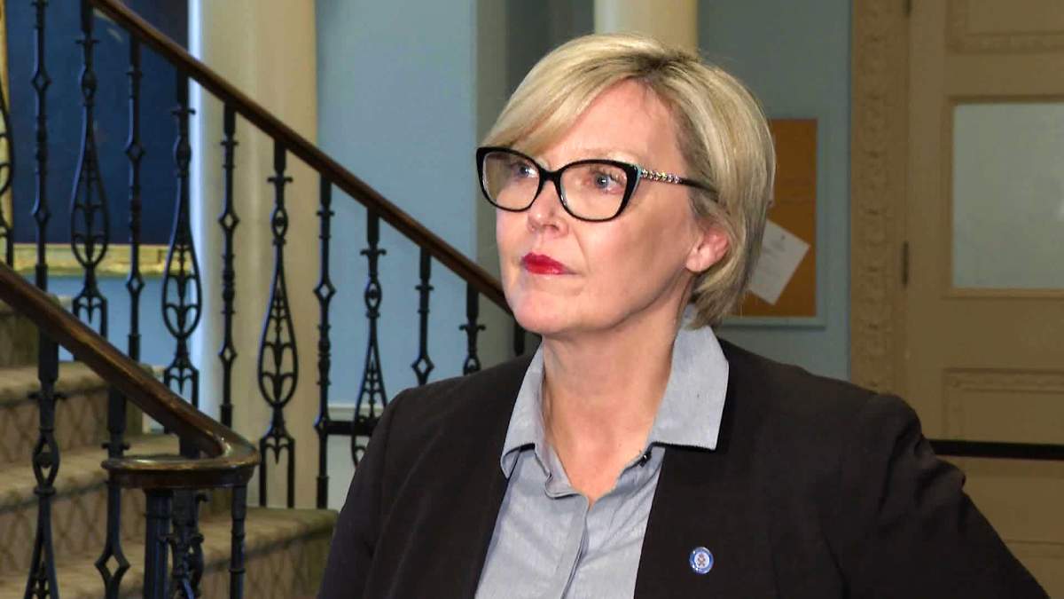 Elizabeth Smith-McCrossin speaks with reporters at the legislature on April 4, 2023.
