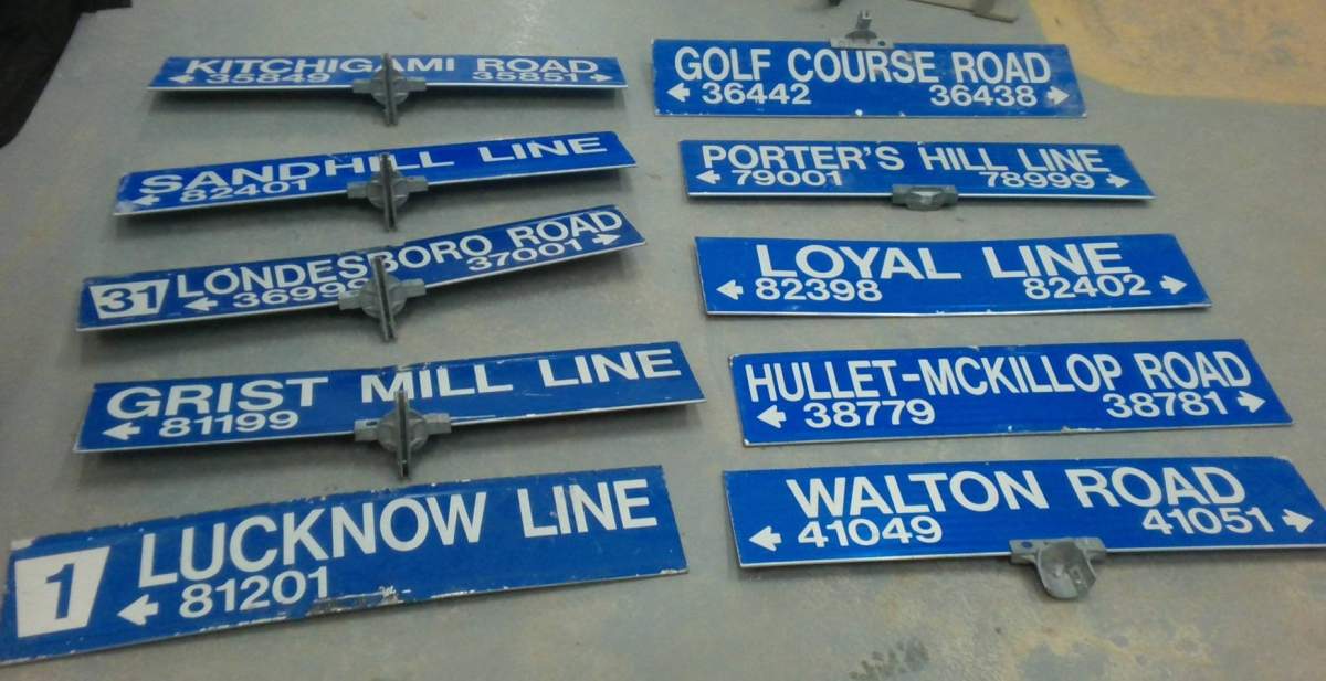 Ten road signs laid out.