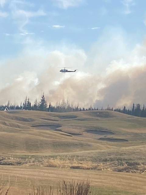 Emergency crews fighting a wildfire near Trestle Creek Golf Resort in Parkland County on Saturday, April 29, 2023.