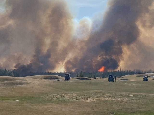Emergency crews fighting a wildfire near Trestle Creek Golf Resort in Parkland County on Saturday, April 29, 2023.
