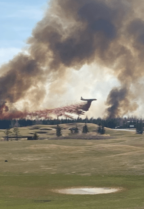 Emergency crews fighting a wildfire near Trestle Creek Golf Resort in Parkland County on Saturday, April 29, 2023.