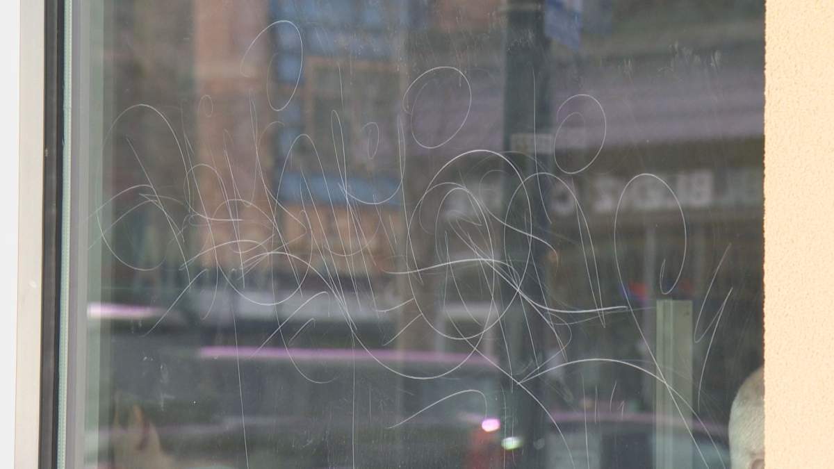 This is the damage left behind on windows at about 30 businesses in Kelowna’s Pandosy Village area.