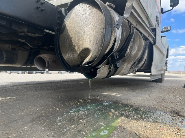 The semi’s fuel is seen leaking on the roadway.